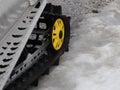 snowmobile caterpillar detail on the snow Royalty Free Stock Photo