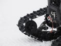 snowmobile snowmobile caterpillar detail on the snow Royalty Free Stock Photo