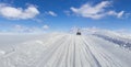 Snowmobile driving on a snow hill