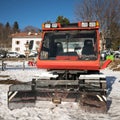 Snowmobile parked at the end of a ski slope. Royalty Free Stock Photo