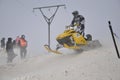 Snowmobile racer sprints on the way down