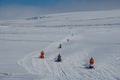 Snowmobile riders riding in the Icelandic highlands