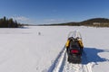 Snowmobile on a track on a frozen morass