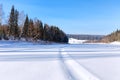 Snowmobile track on frozen river