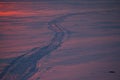 Snowmobile track on the frozen river