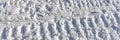Snowmobile track marks on the snow.Panoramic background Royalty Free Stock Photo