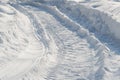 Snowmobile tracks in deep snow Royalty Free Stock Photo