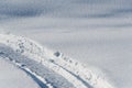 Snowmobile tracks in deep snow Royalty Free Stock Photo