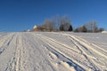 Snowmobile tracks in a field Royalty Free Stock Photo