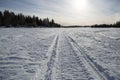 Snowmobile Tracks on Frozen Lake Royalty Free Stock Photo