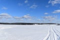 Snowmobile tracks under a blue sky Royalty Free Stock Photo
