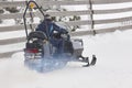 Snowmobile under the snow. White winter mountain landscape