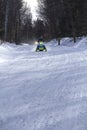 Snowmobilers ride on a trail on Bald Mountain, Rangeley, Maine.