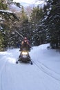 Snowmobilers ride on a trail on Bald Mountain, Rangeley, Maine.