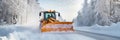A snowplough working to remove snow from a road after a winter storm. Winter road clearing Royalty Free Stock Photo