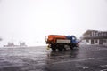 Snowploughs machinery plowing snow on ground at cable car station