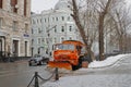 Snowplow cleans from the road snow in Moscow Royalty Free Stock Photo