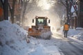 Snowplow clearing the street of snow