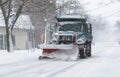 Snowplow clearing a strreet during a snow storm