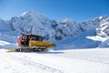 Snowplow in the mountains prepairing piste