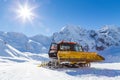 Snowplow in the mountains prepairing piste Royalty Free Stock Photo