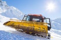 Snowplow in the mountains prepairing piste