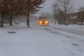 Snowplow removing snow from city road