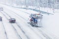 Snowplow removing the Snow from the Highway during a Snowstorm Royalty Free Stock Photo