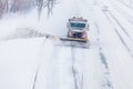 Snowplow removing the Snow from the Highway during a Snowstorm Royalty Free Stock Photo