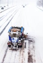 Snowplow removing the Snow from the Highway during a Snowstorm Royalty Free Stock Photo