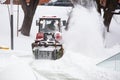 Snowplow removing snow from road in Lviv