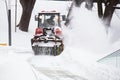 Snowplow removing snow from road in Lviv