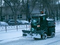 Snowplow removing snow on street after blizzard Royalty Free Stock Photo