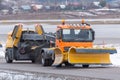 Snowplow rides at the airport, view of the cabin near