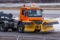 Snowplow rides at the airport, view of the cabin near