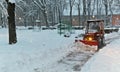 Snowplow Tractor cleaning snow Royalty Free Stock Photo