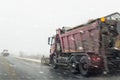 Snowplow truck removing dirty snow from city street or highway after heavy snowfalls. Traffic road situation. Weather Royalty Free Stock Photo