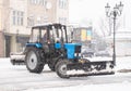 Snowplow truck removing snow on the street after blizzard. Intentional motion blur Royalty Free Stock Photo