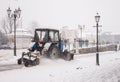Snowplow truck removing snow on the street after blizzard. Intentional motion blur Royalty Free Stock Photo