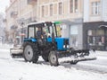 Snowplow truck removing snow on the street after blizzard. Intentional motion blur Royalty Free Stock Photo