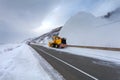 Snowplow truck Snow removal truck is removing the snow from the highway during a cold snowstorm winter day. Royalty Free Stock Photo