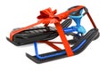 Snowracer Snow Sled with red bow and ribbon, gift concept. 3D rendering