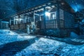 It snows over chalet by night Royalty Free Stock Photo