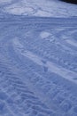 Snowscape with skid marks into the snow Royalty Free Stock Photo