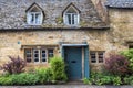Typical pretty cottages with climbing plants with yellow Cotswold limestone walls in Snowshill, Cotswolds - England Royalty Free Stock Photo