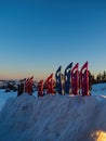 Snowshoes left plucked into the snow during sunset