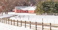 Snowstorm red barn and farm Royalty Free Stock Photo