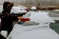 woman shoveling and removing snow from her car, stuck snow Royalty Free Stock Photo