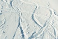 Snowy abstract off-piste skiing backround with ski and snowboard trails and tracks on new virgin powder snow. morning Royalty Free Stock Photo