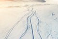 Snowy abstract off-piste skiing backround with ski and snowboard trails and tracks on new virgin powder snow. morning Royalty Free Stock Photo